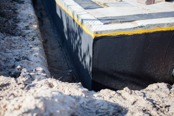 Professional Waterproofing technician working in Willard, OH